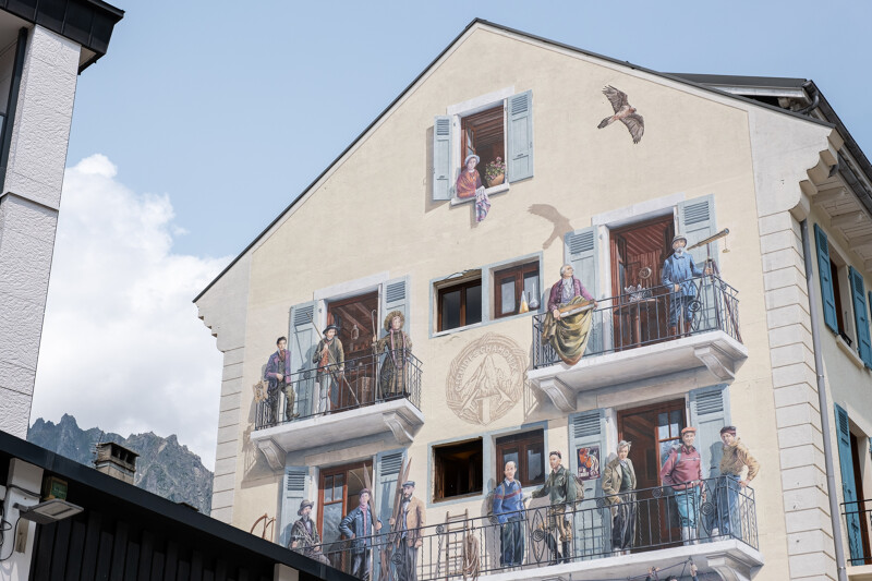 Mural painting in the centre of Chamonix town depicting the first moutain guides on a balcony
